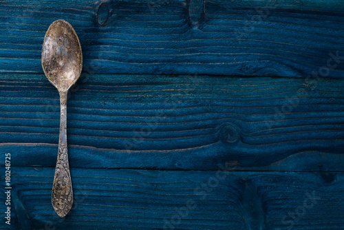 Old cutlery. On a wooden background. Top view. Free space for text.