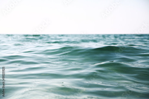 Sea waves background.Pure light blue and green water.