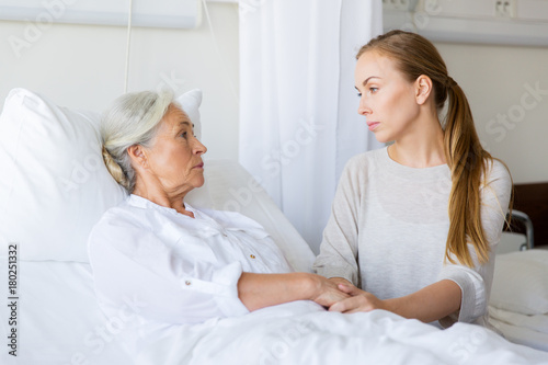 daughter visiting her senior mother at hospital