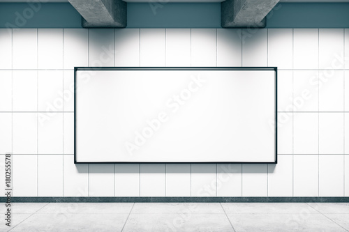 Metro station with blank poster