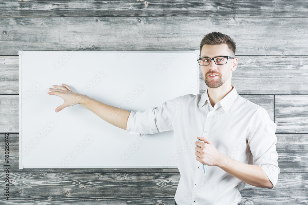 European man pointing at whiteboard Stock-Foto | Adobe Stock