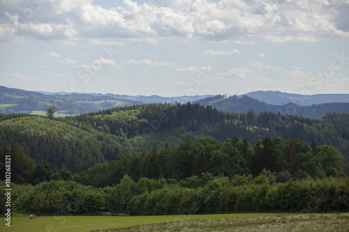 Beautiful Czech summer landscape on hills with forest