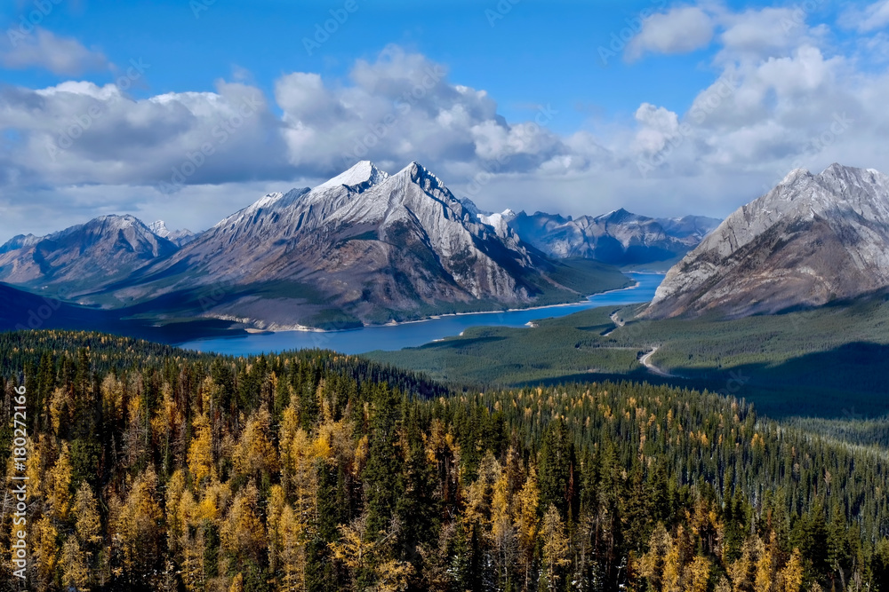 Rocky Mountains landscape with lake, mountains and golden larches. Tents Ridge Horseshoe. Spray Valley Park. Kananaskis. Alberta. Canada. Rocky Mountains landscape with lake, mountains and golden larches. Tents Ridge Horseshoe. Spray Valley Park. Kananaskis. Alberta. Canada.