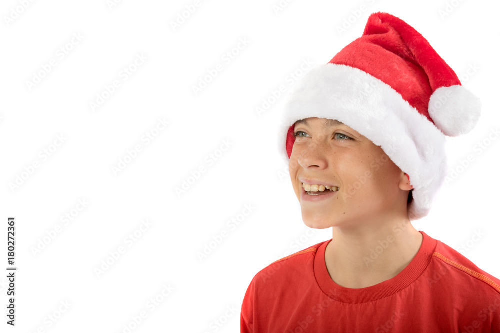 Happy teenage boy wearing a Christmas hat Happy teenage boy wearing a Christmas hat