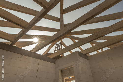 Roofers make the roof of a house in traditional construction