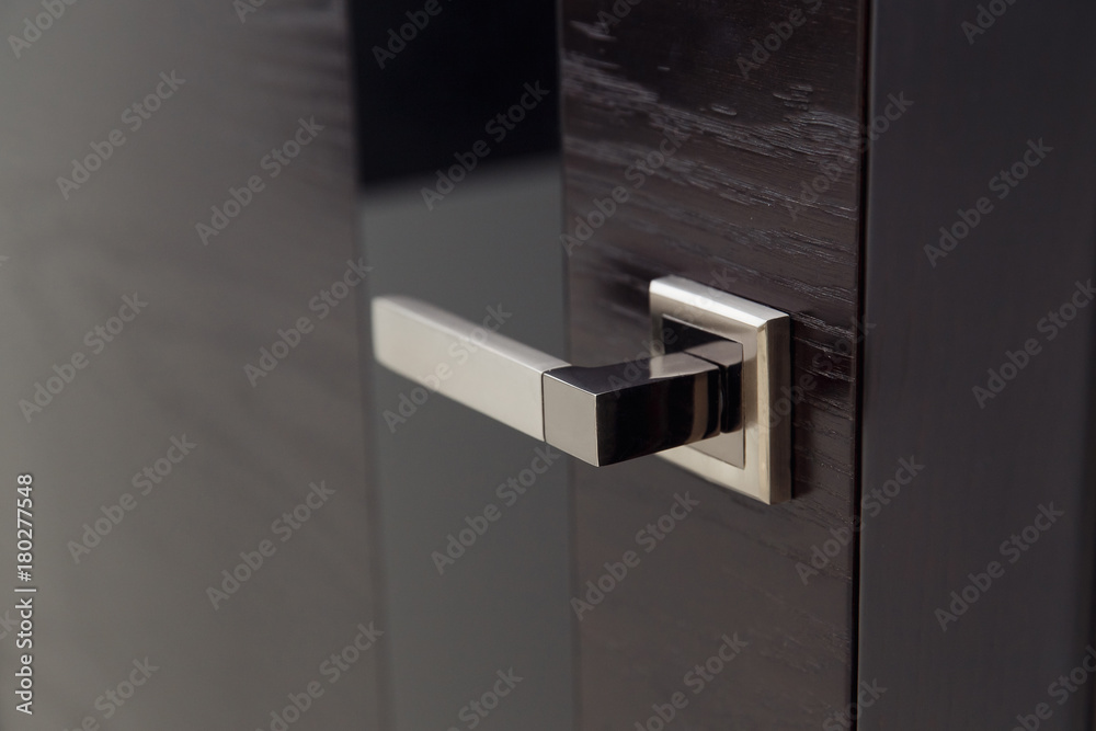 Closeup handle. Modern door handle, tilt view. - obrazy, fototapety, plakaty 