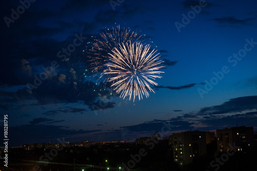 Firework at the night cloudy sky