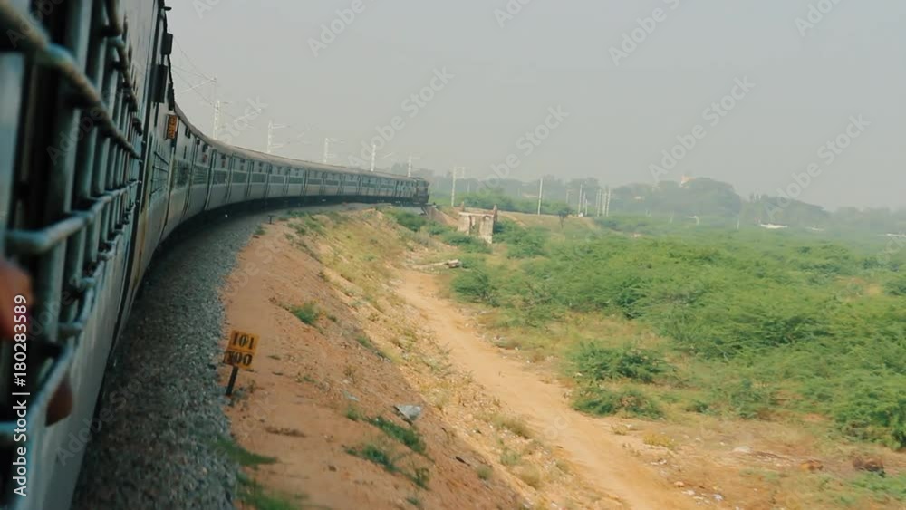 Train goes around arc area of dry Bush. Beautiful sight of turning of ...