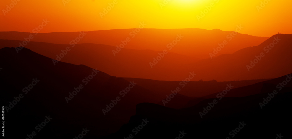 Fototapeta premium sunset in the mountains, layered red