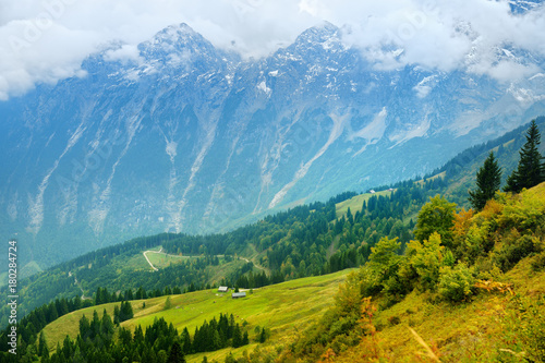 Breathtaking lansdcape of mountains, forests and small Bavarian villages in the distance. Scenic view of Bavarian Alps with majestic mountains in the background. © MNStudio