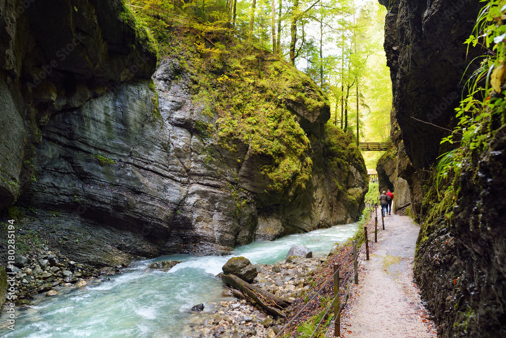 Φωτογραφία Blue water flowing in the Partnach Gorge or Partnachklamm, incised by a mountain stream in the Reintal valley near the town of Garmisch-Partenkirchen