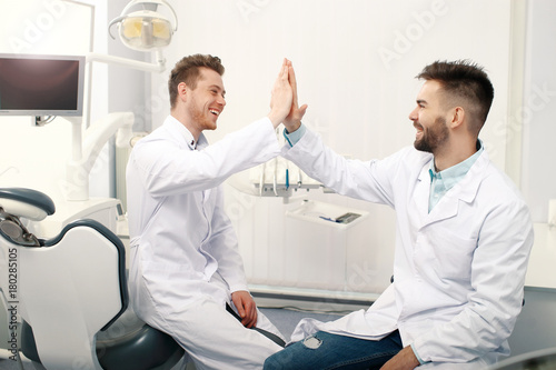 Two male dentists in clinic