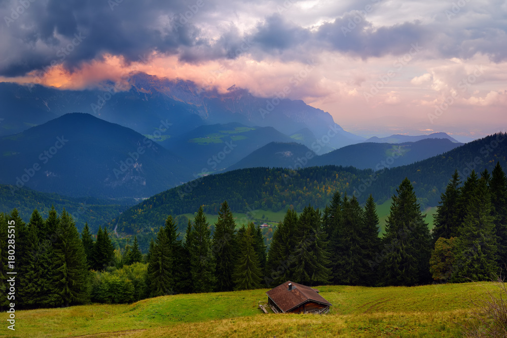 Breathtaking lansdcape of Bavarian mountains and forests on cloudy sunset. Scenic view of Bavarian Alps with majestic mountains in the background. Breathtaking lansdcape of Bavarian mountains and forests on cloudy sunset. Scenic view of Bavarian Alps with majestic mountains in the background.