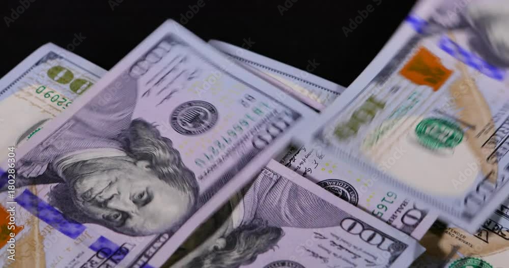Closeup of someone counting American dollar bills on table. Shot in 4k resolution Closeup of someone counting American dollar bills on table. Shot in 4k resolution