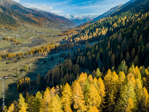 Aerial view of mountain valley in Switzerland. Fall colors during indian summer