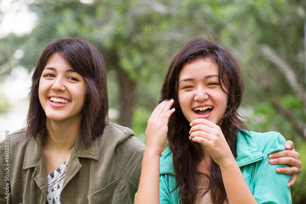 Asian mother laughing and huging her children. Asian mother laughing and huging her children.