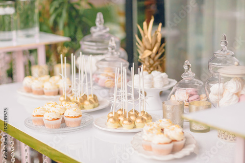 Wedding candy bar table. Cakes and other sweets