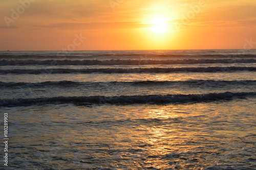 Sunrise  with reflection in the sea  on the beach Perequ   A  u in Ubatuba  Brazil
