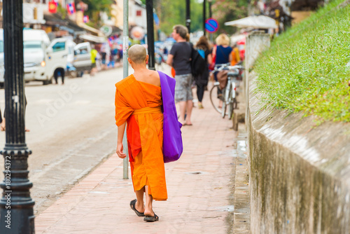 Monks on a city street in Louangphabang, Laos. Copy space for text.