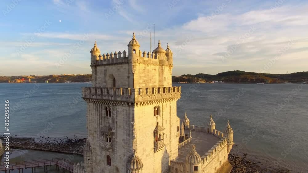 Lisbon, Portugal, aerial view of Belem Tower (Torre de Belem) by the Tagus river at sunset. Lisbon, Portugal, aerial view of Belem Tower (Torre de Belem) by the Tagus river at sunset.