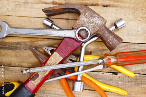 Group Of Used Hardware Tools Over Wooden Background