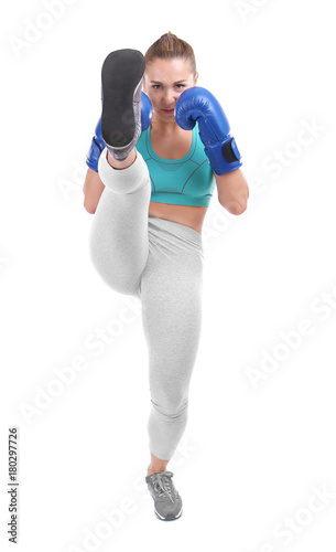 Female kickboxer on white background