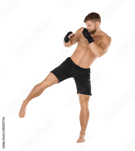 Male kickboxer on white bac...