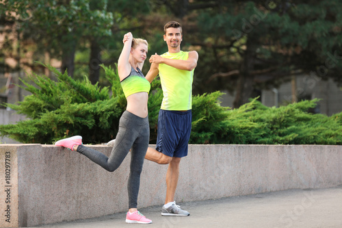 Young couple stretching out...