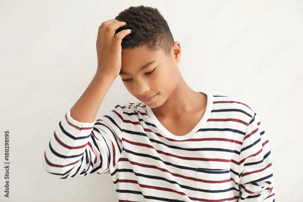 Charming African-American teenager on light background Charming African-American teenager on light background