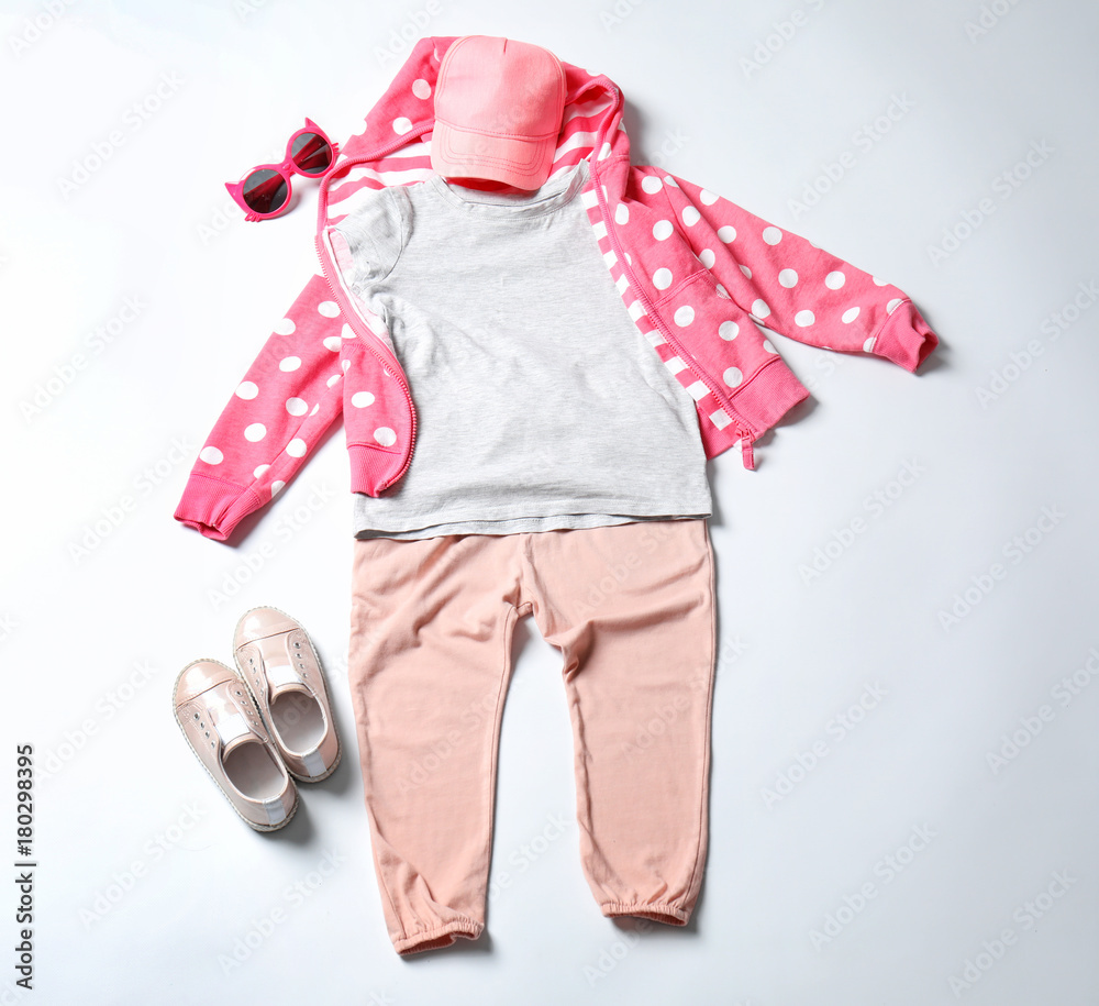 Child's clothes and sneakers on white background Child's clothes and sneakers on white background