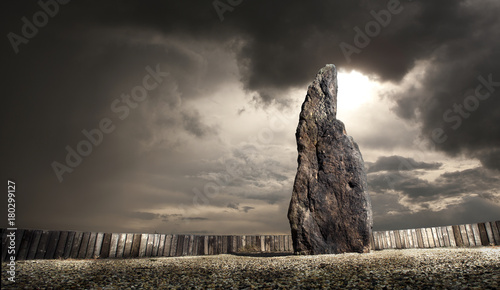 Menhir A stone man near village Klobuky in the Czech Republic