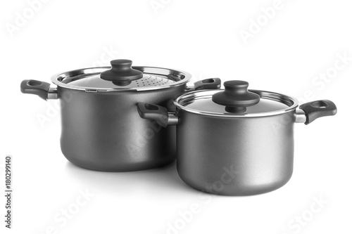 Saucepans on white background