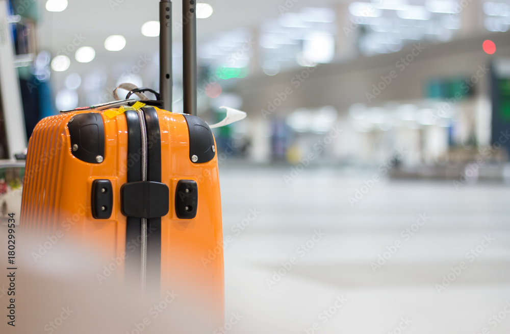 Yellow Suitcase safety bag in airport departure travel luggage for holiday  vacation at blur airplane terminal waiting area for passenger hall  background, focus on suitcases. Photos | Adobe Stock