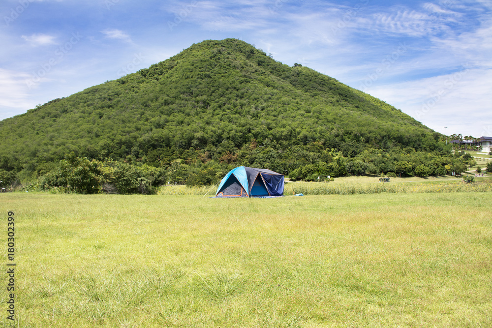 Travelers people build tent camping on grass field for rest and sleep near mountain at  Chang Hua Man Royal Initiative and Agricultural Project