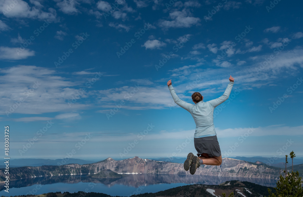 Woman Leaps at Overlook to Crater Lake