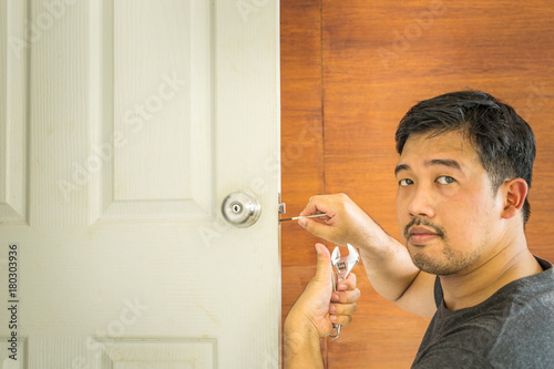 locksmith service on white wood door