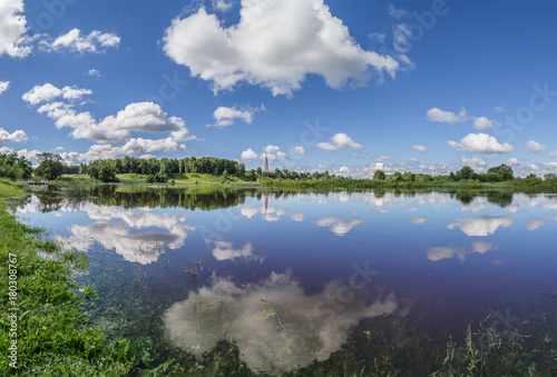 River and white clouds above it on a summer day