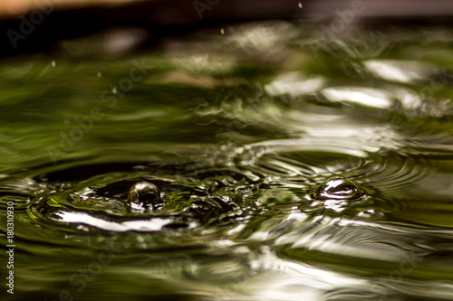 Water drops and wave falling into the water, Natural and peaceful concept