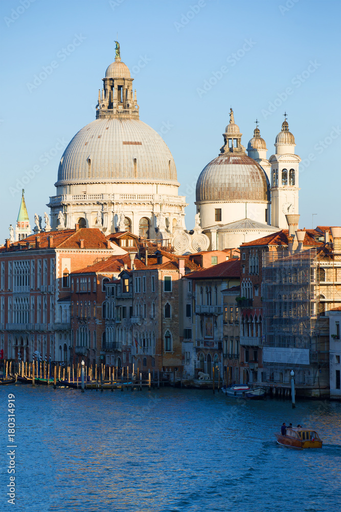 Dome of the Cathedral of Santa Maria della Salute close-up in a cityscape. Venice, Italy