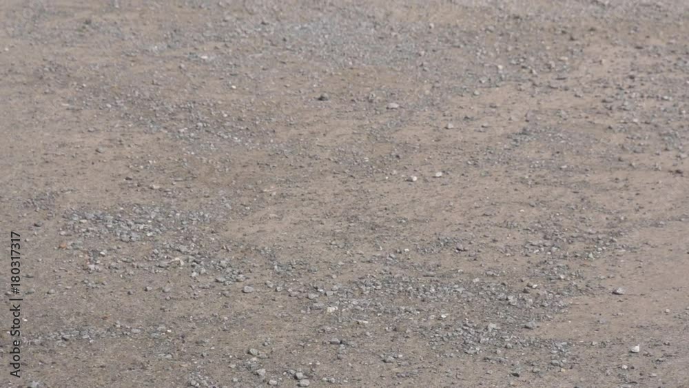 The drone takes off from the ground in slow motion