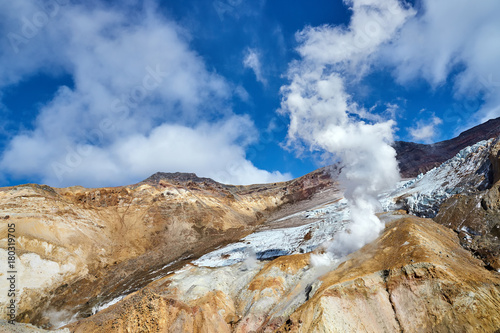 Walking route in the crater of the active volcano Mutnovsky on the Kamchatka Peninsula.Fumarolic fields on thermal areas inside the crater