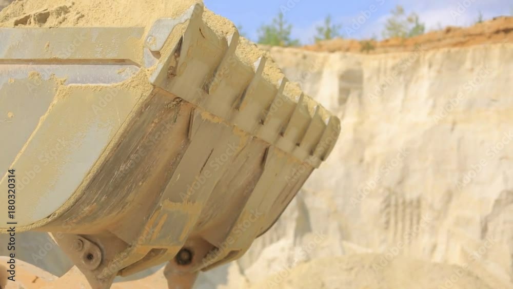 Excavator loads sand in the body of KAMA. Excavator loads sand in the. Sand quarry