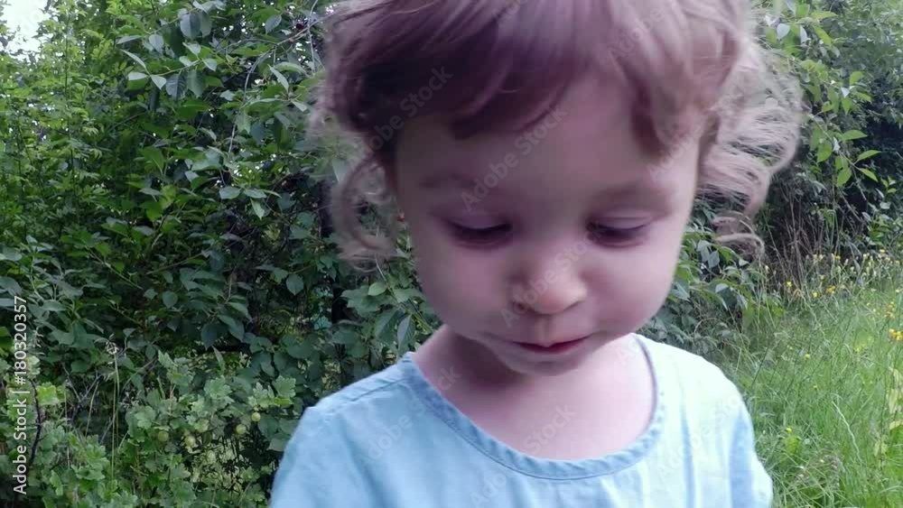slow motion, cute girl eating cherry, fruits in the garden slow motion, cute girl eating cherry, fruits in the garden