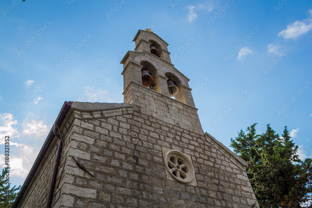 Fototapeta premium A small temple against the sky. Montenegro Orthodox Church