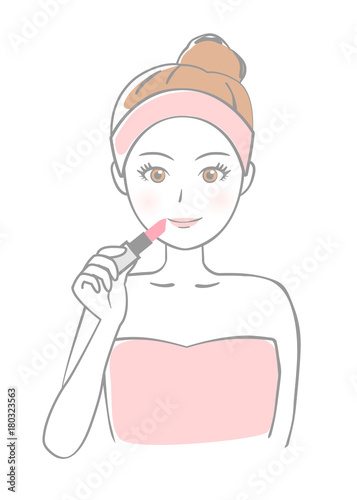 口紅を塗る女性