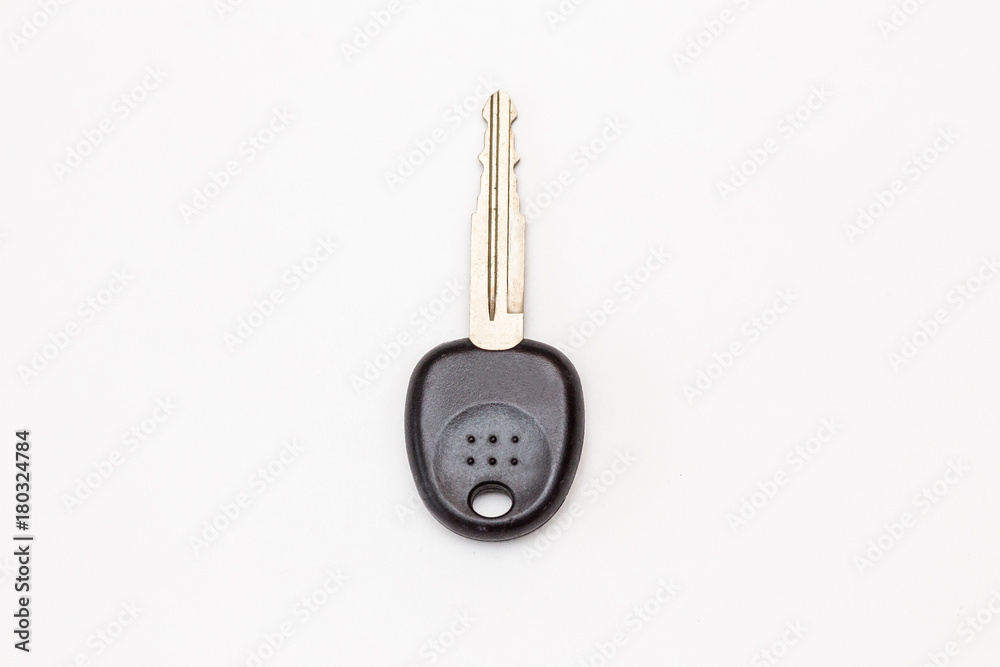 The key to the lock on a white background. The key to the door, car key. The key to the lock on a white background. The key to the door, car key.