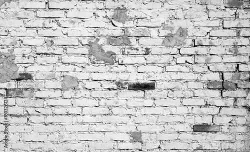 Old weathered brick wall pattern in black and white