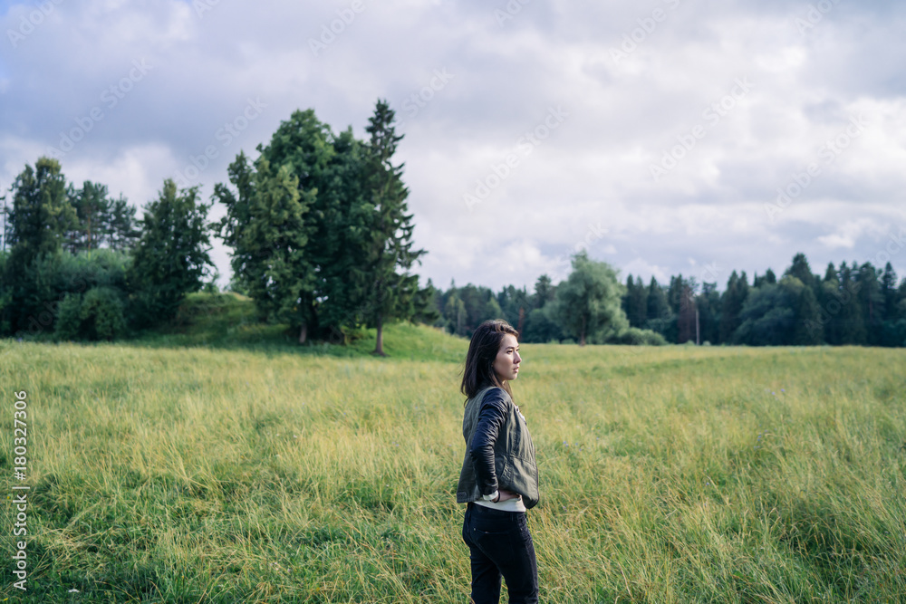 Young woman is enjoying moody autumn weather Young woman is enjoying moody autumn weather