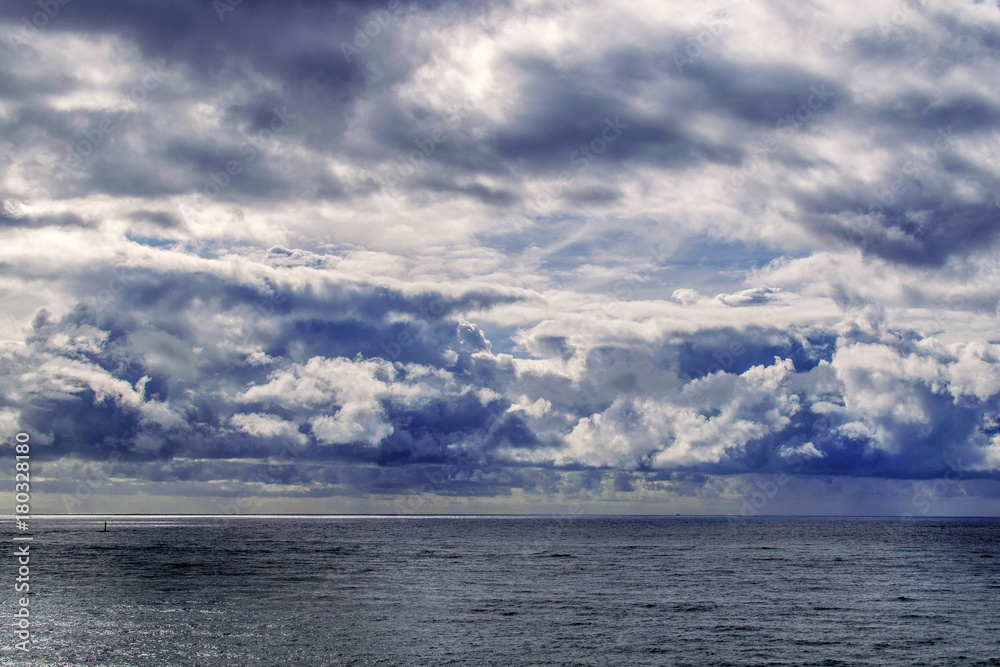 Rainy clouds over the ocean