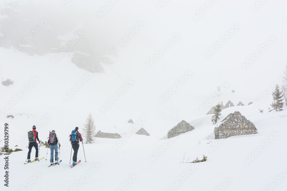 Group of skiers exploring ruins of Great war buildings. Group of skiers exploring ruins of Great war buildings.